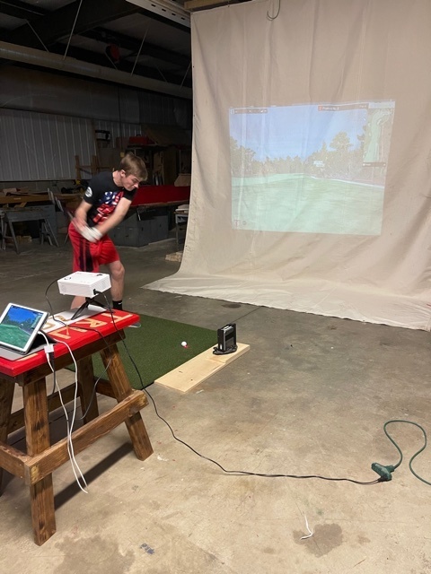 Levi Houck using Golf Simulator